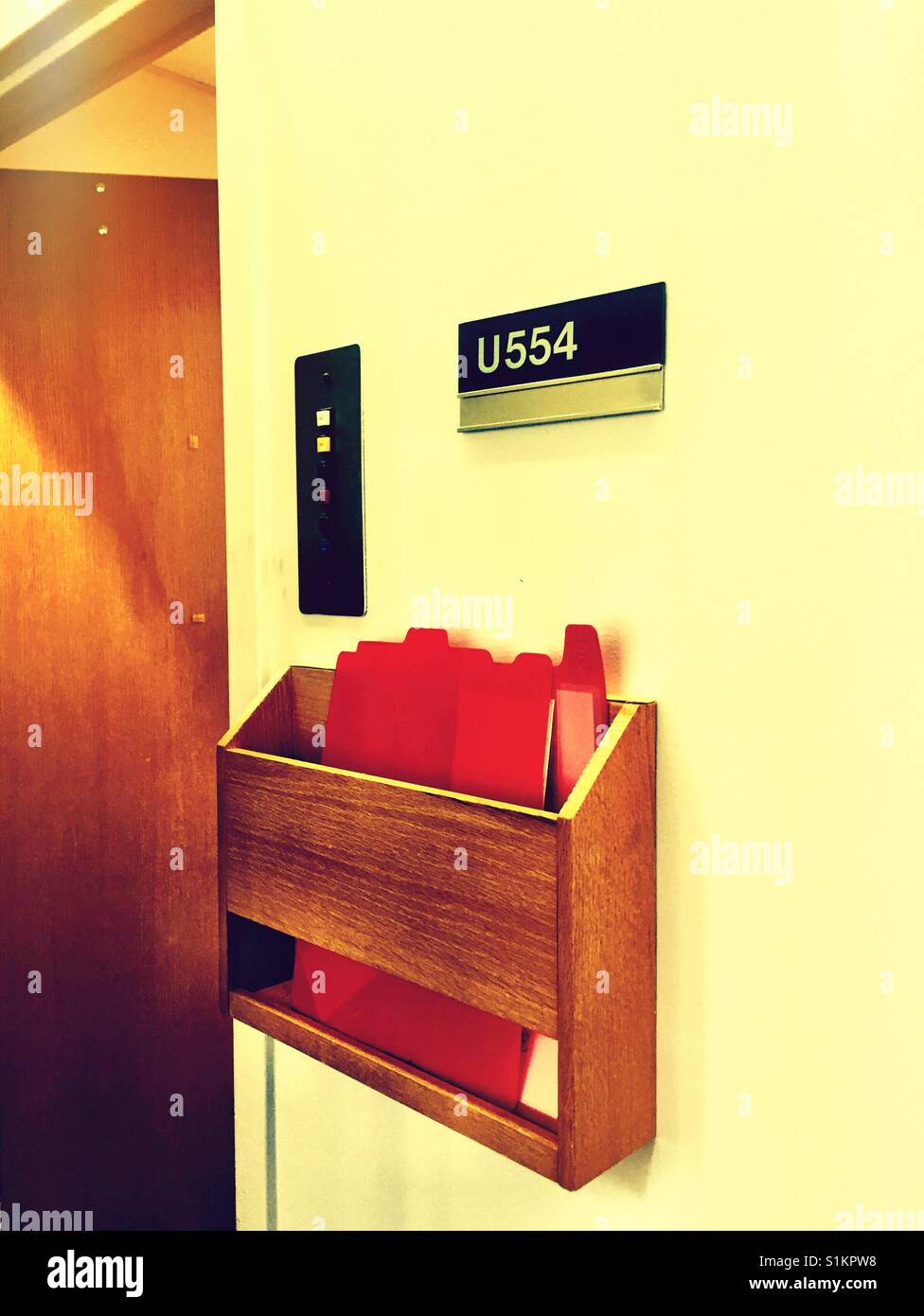 Doctor's charts hanging outside examination room - Smartphone Captured Stock Image