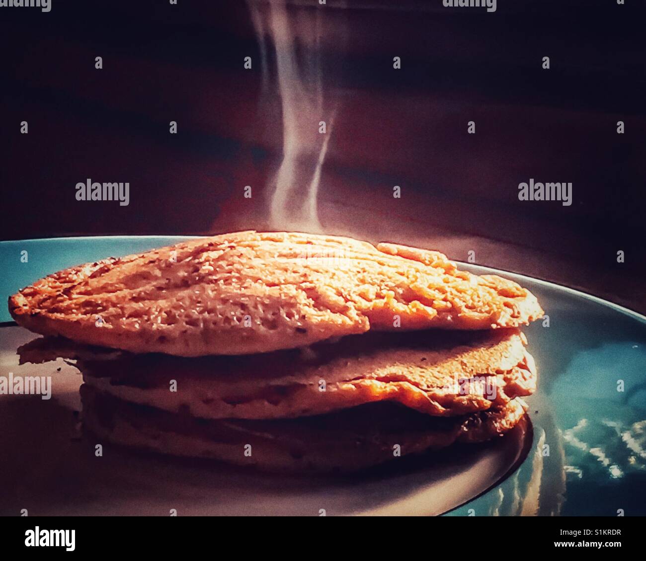 Pancakes, hot and steamy off the griddle Stock Photo Alamy