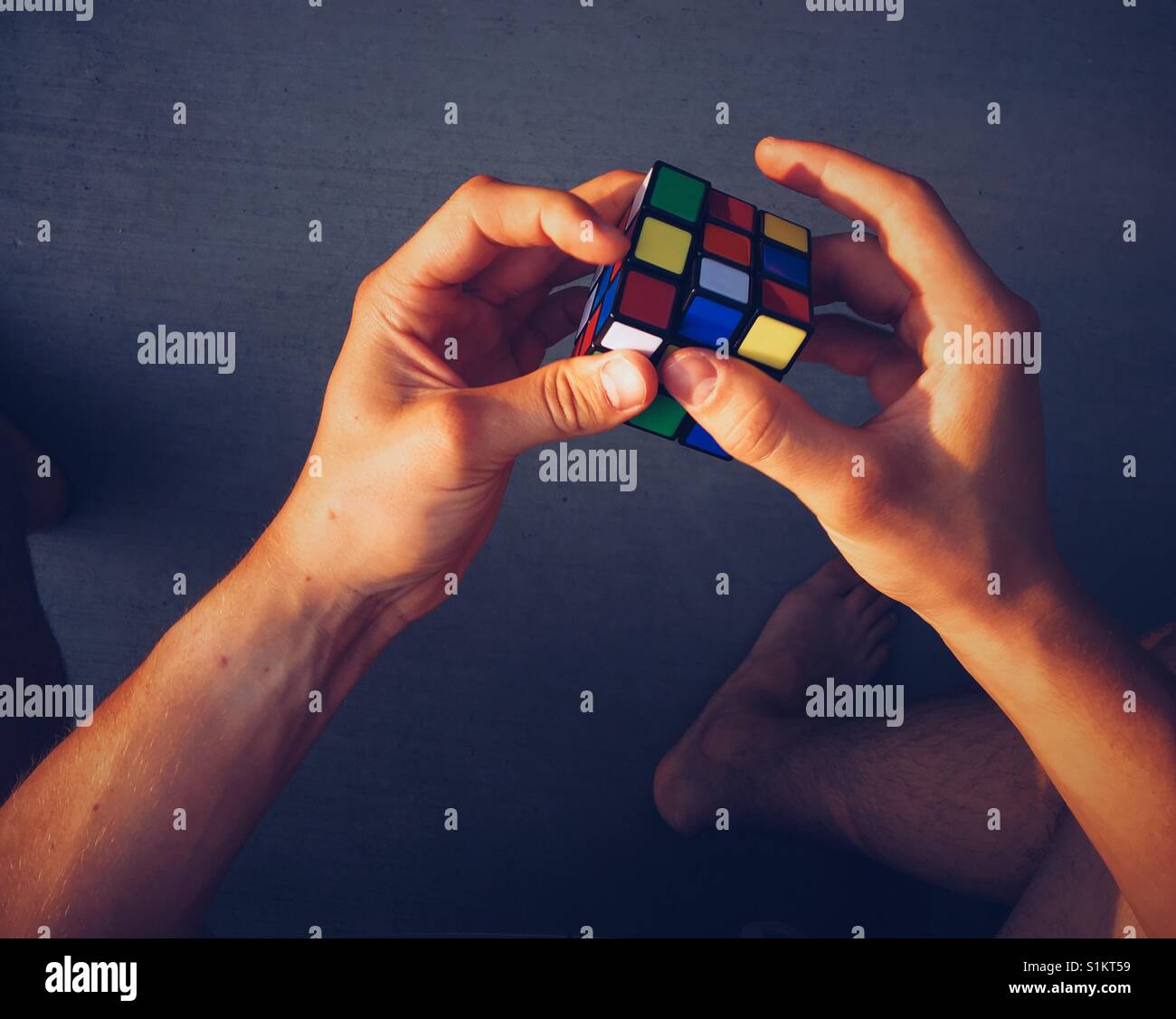 Rubik's Cube being solved. Point of view shot. Space for copy. Stock Photo