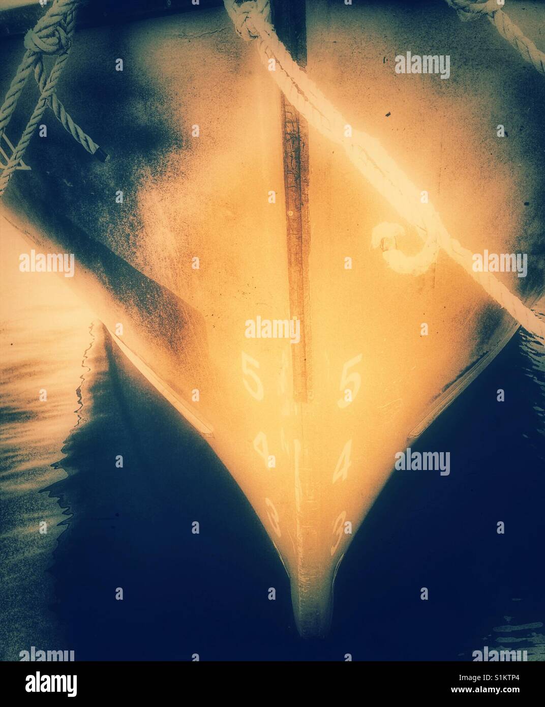 Ship's draft on hull of moored ship. The vertical distance between the waterline and the bottom of the hull. - Smartphone Captured Stock Image