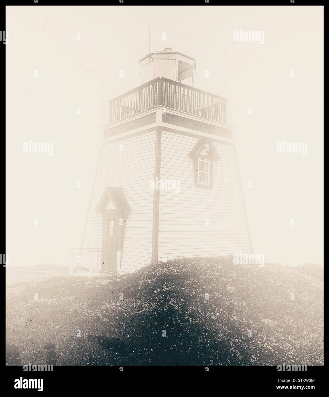 Lighthouse in mist, Newfoundland, Canada - Smartphone Captured Stock Image