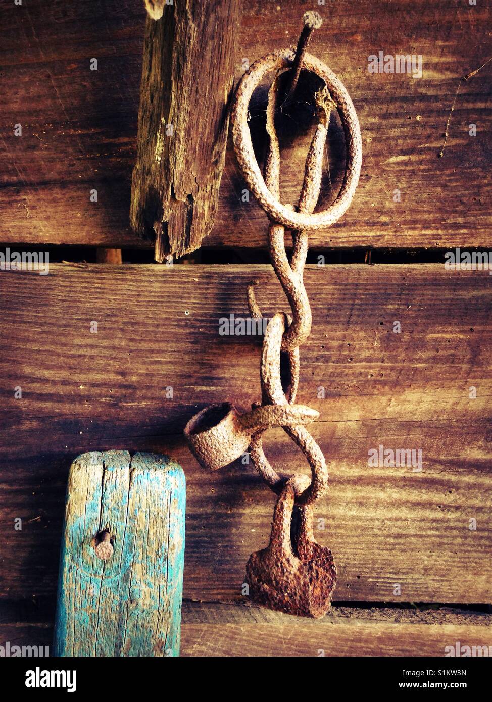 Sharp filter on photo of metal hardware and blue painted board from old Conestoga wagon - Smartphone Captured Stock Image