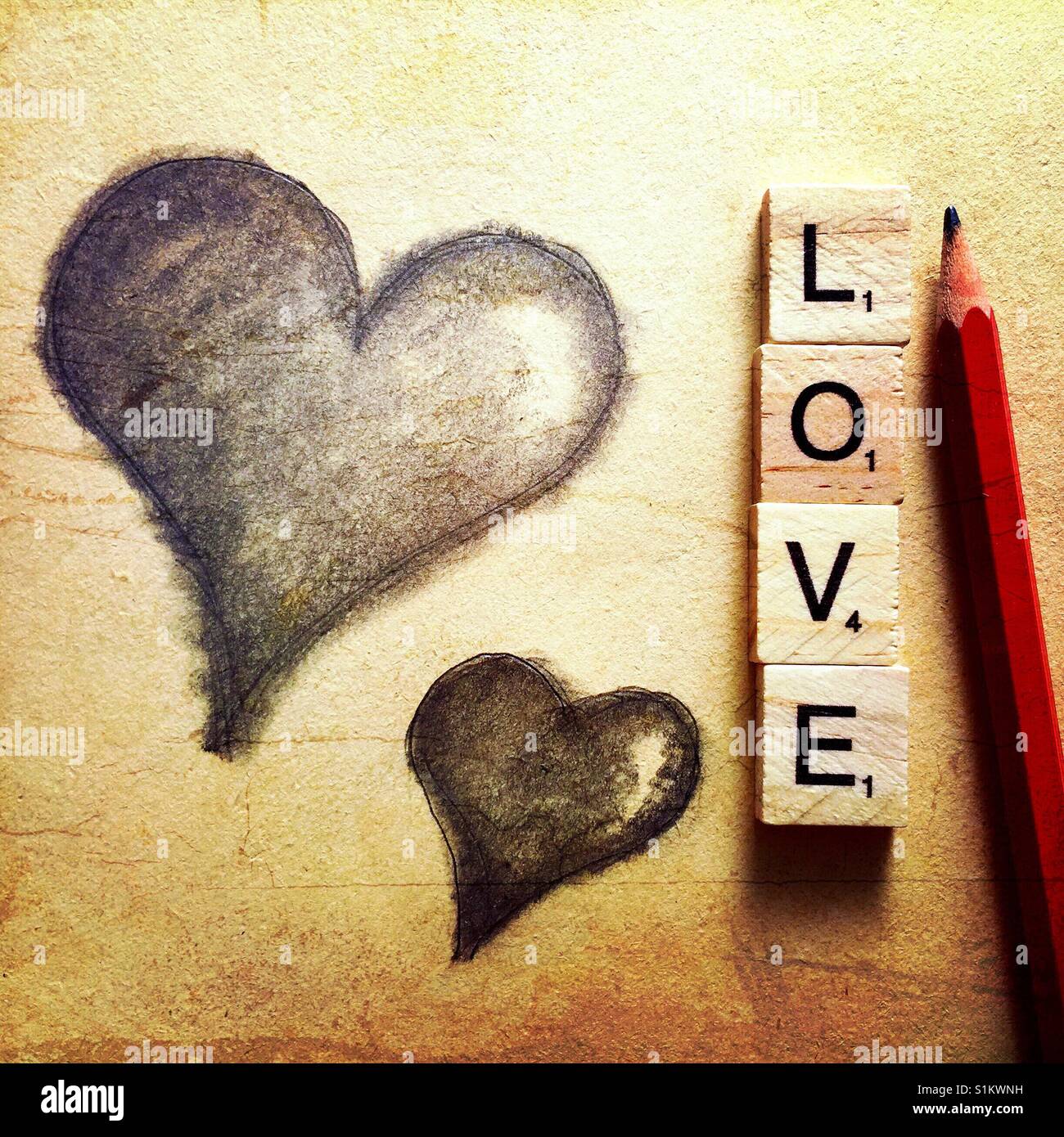 A simple pencil drawing of two hearts with a pencil and the word ...