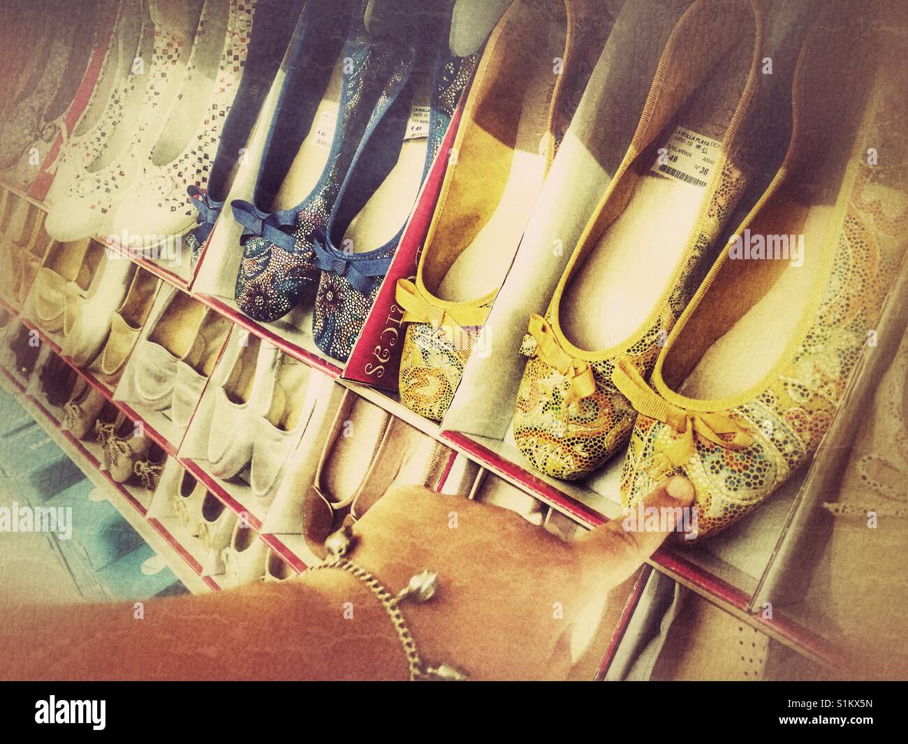 Pointing at a pair of shoes in a Spanish shoe shop Stock Photo Alamy
