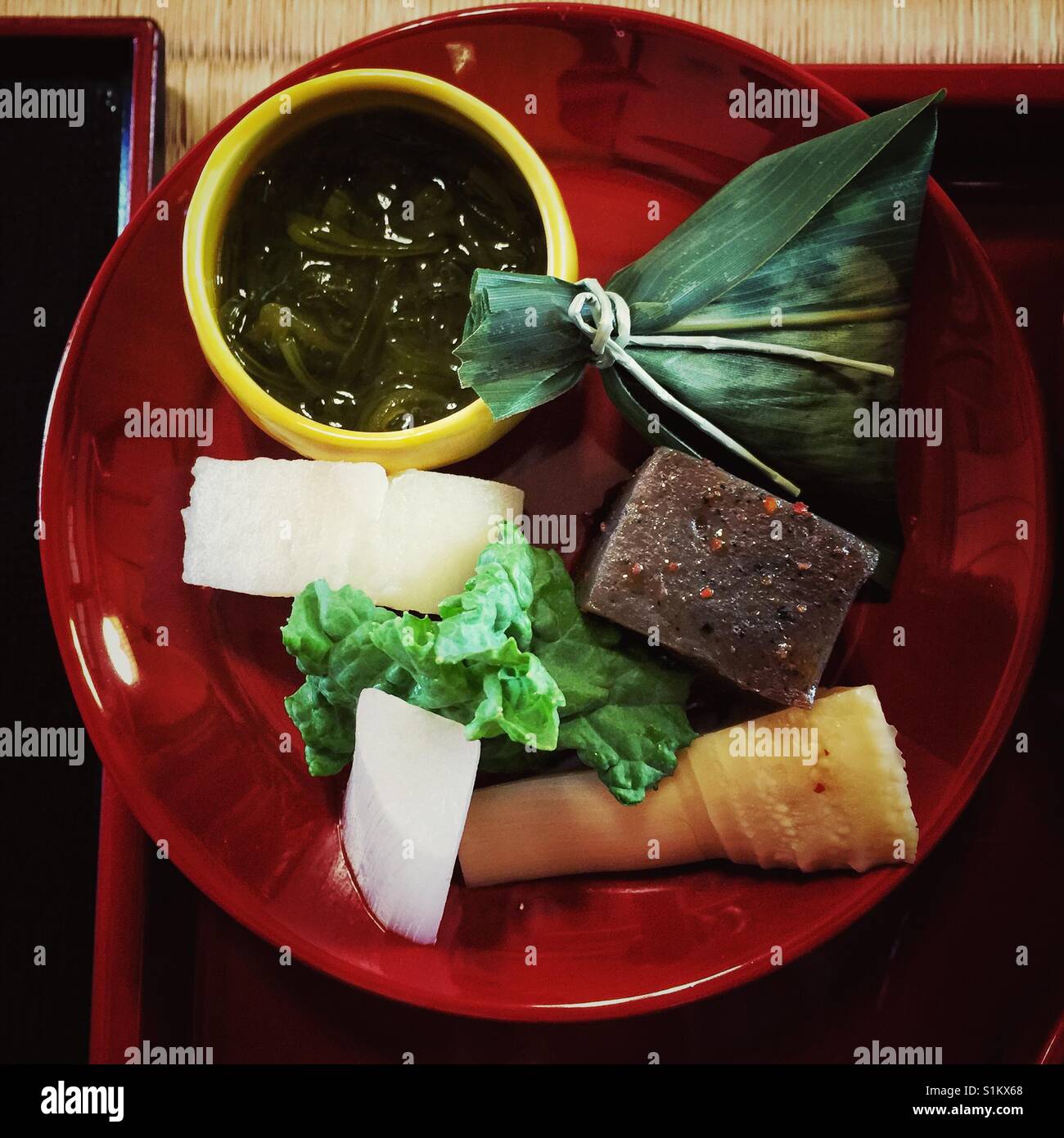 Vegan Japanese monastic food on red lacquered plate Stock Photo