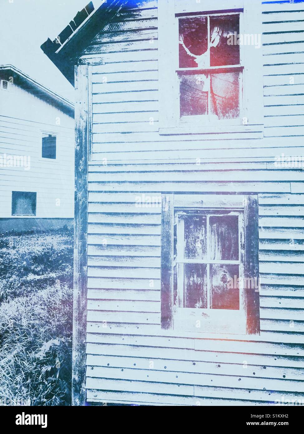 Neighbouring abandoned and new wooden houses, Canada - Smartphone Captured Stock Image