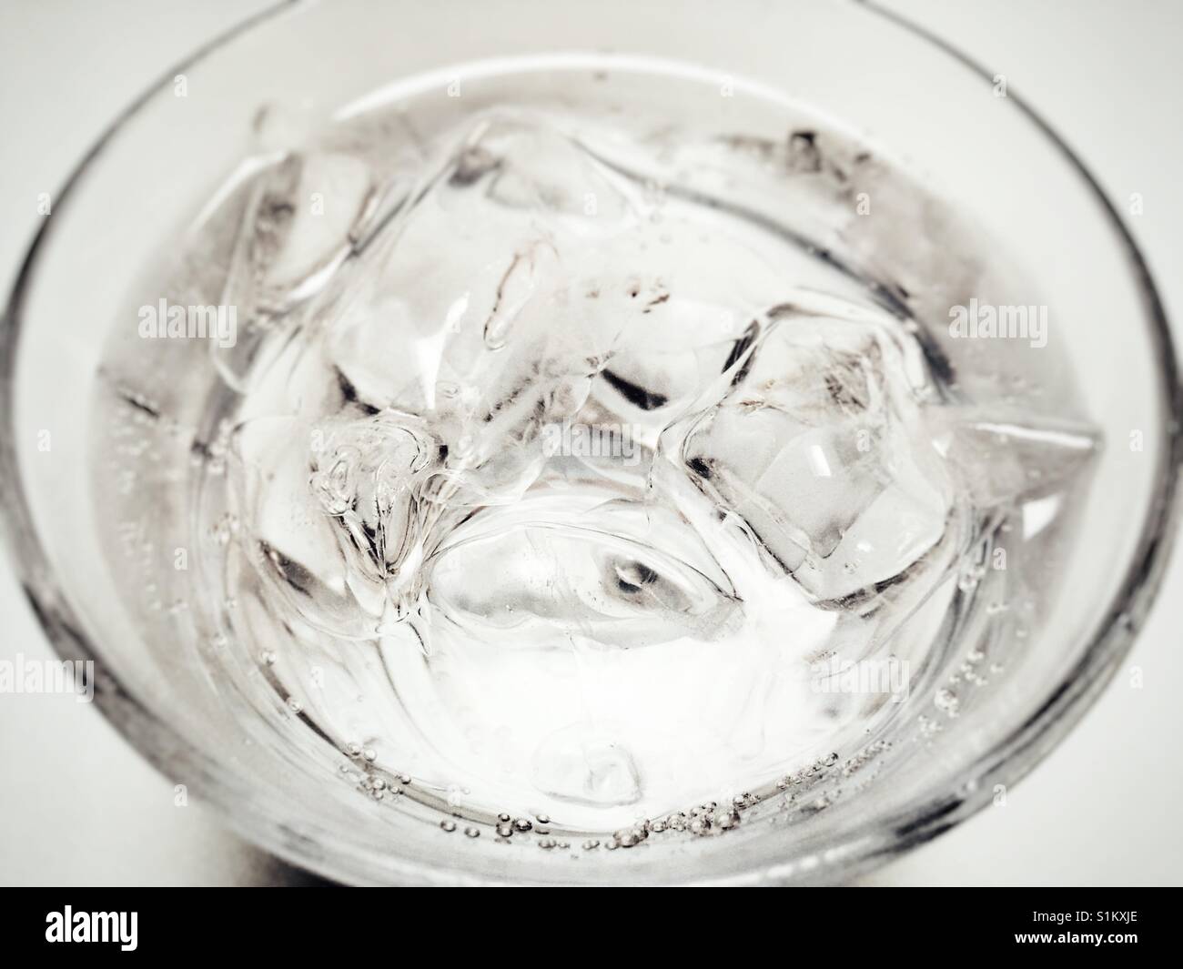 Sparkling water with ice cubes Stock Photo - Alamy