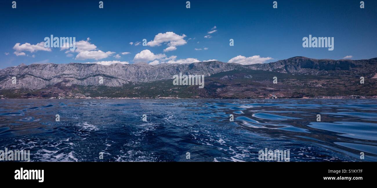 Panorama of mountain Biokovo and Makarska riviera in Croatia from the sea Stock Photo