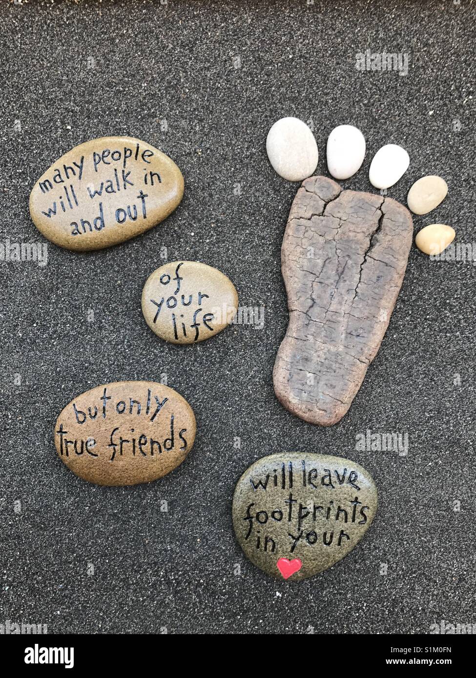 Many people will walk in and out of your life, but only true friends will leave footprints in your heart - Smartphone Captured Stock Image