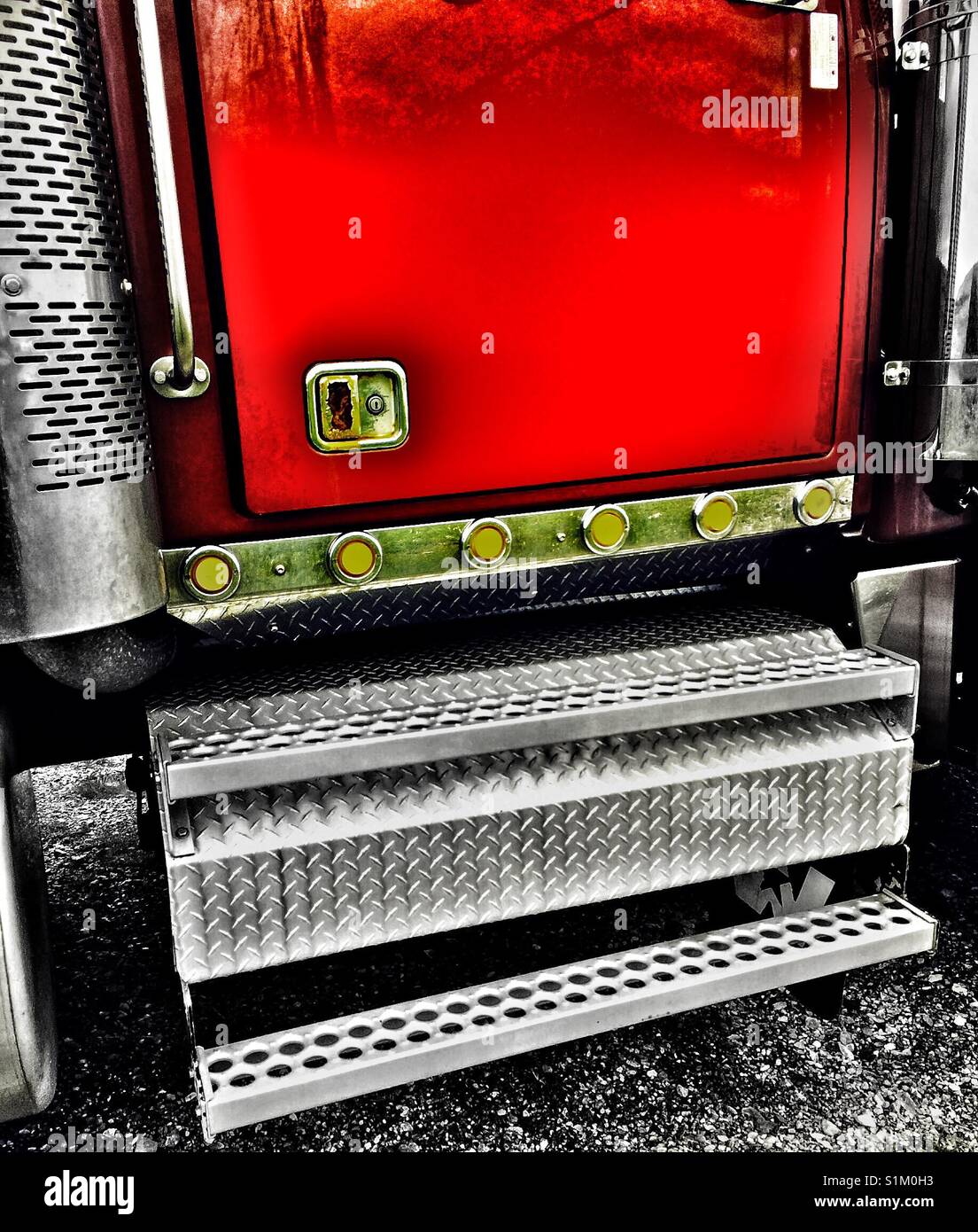 Chrome and door of red American commercial truck - Smartphone Captured Stock Image