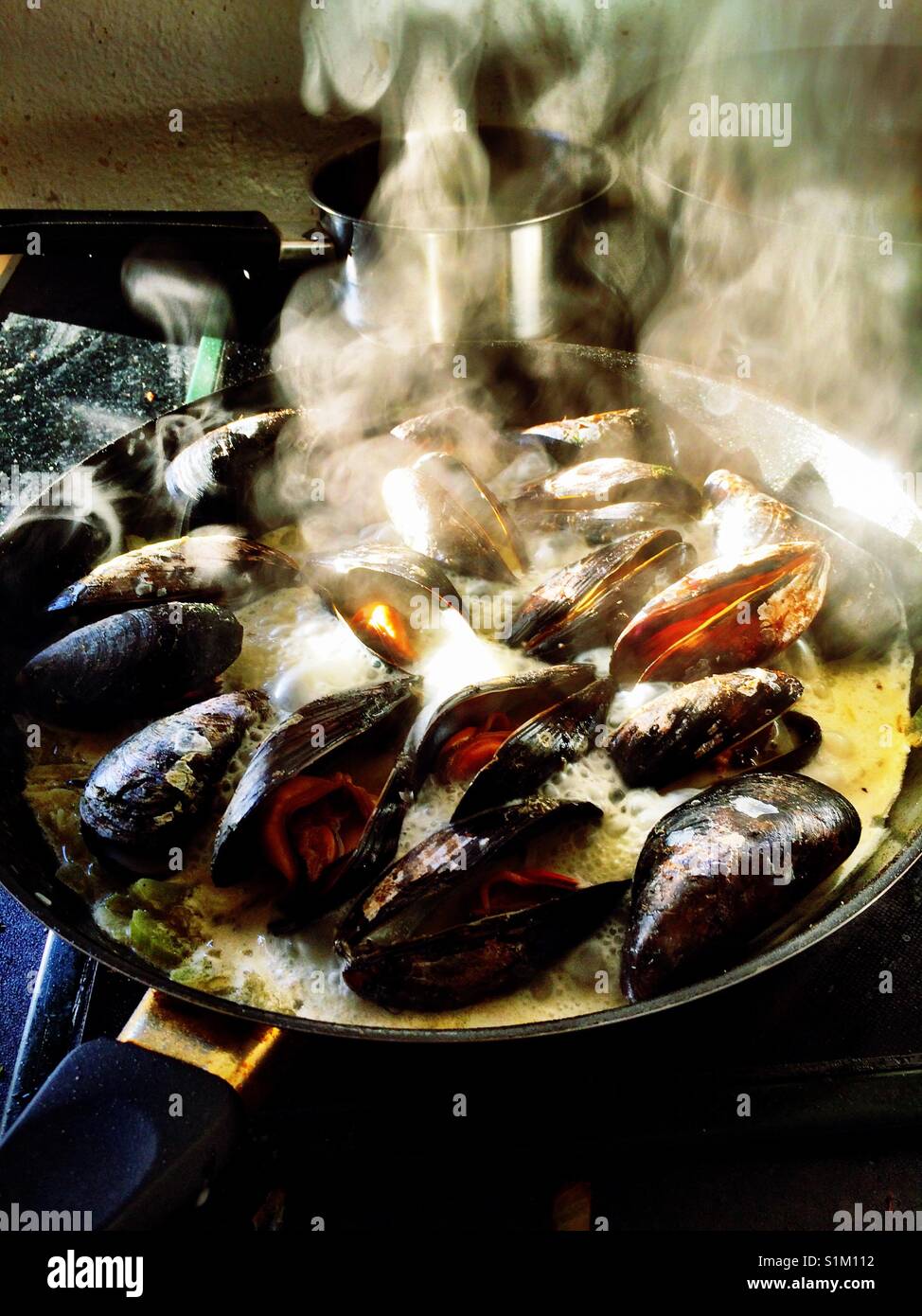 Mussels cooking Moules Marinière - Smartphone Captured Stock Image