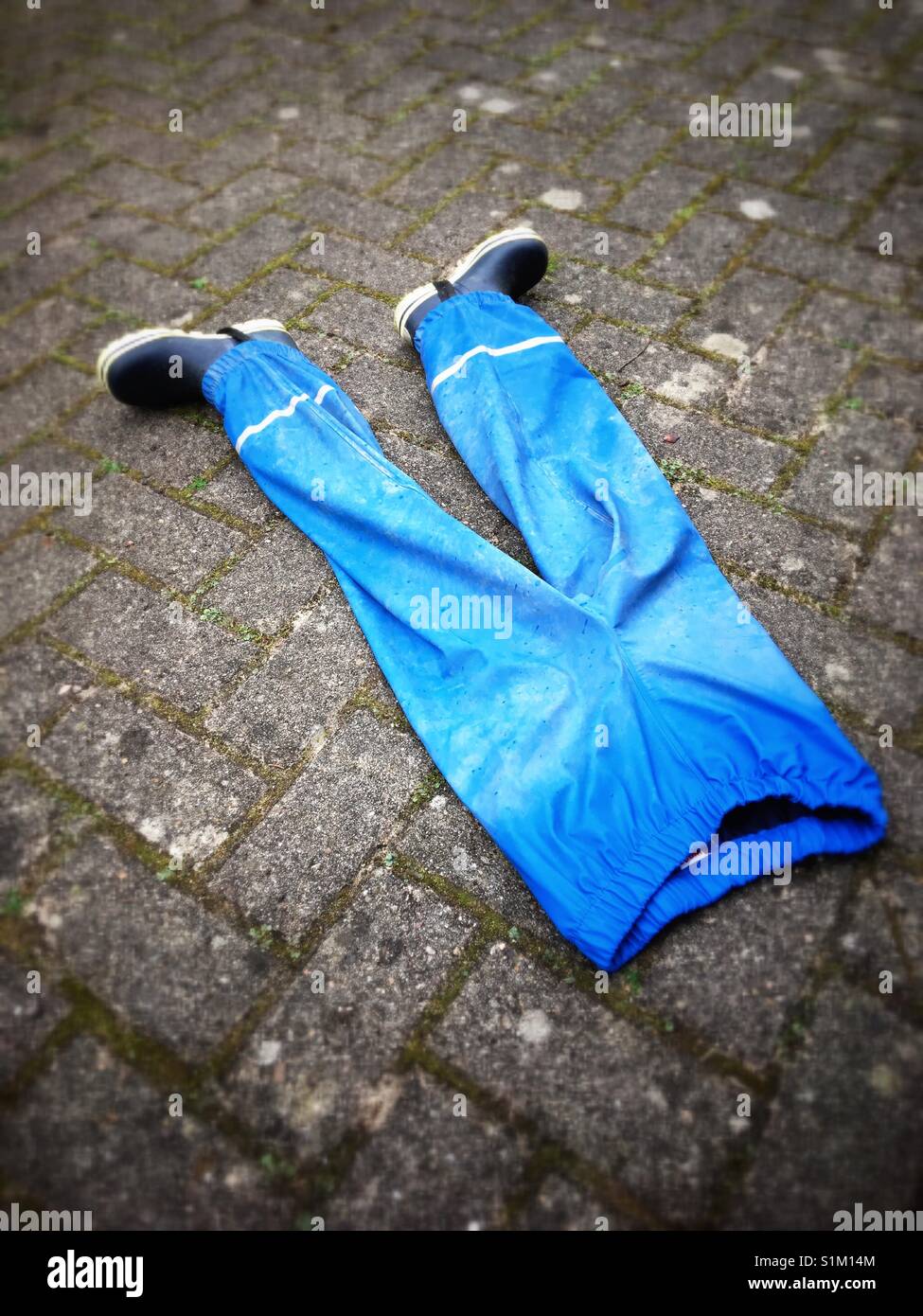 Blue rubber pants and wellingtons Stock Photo