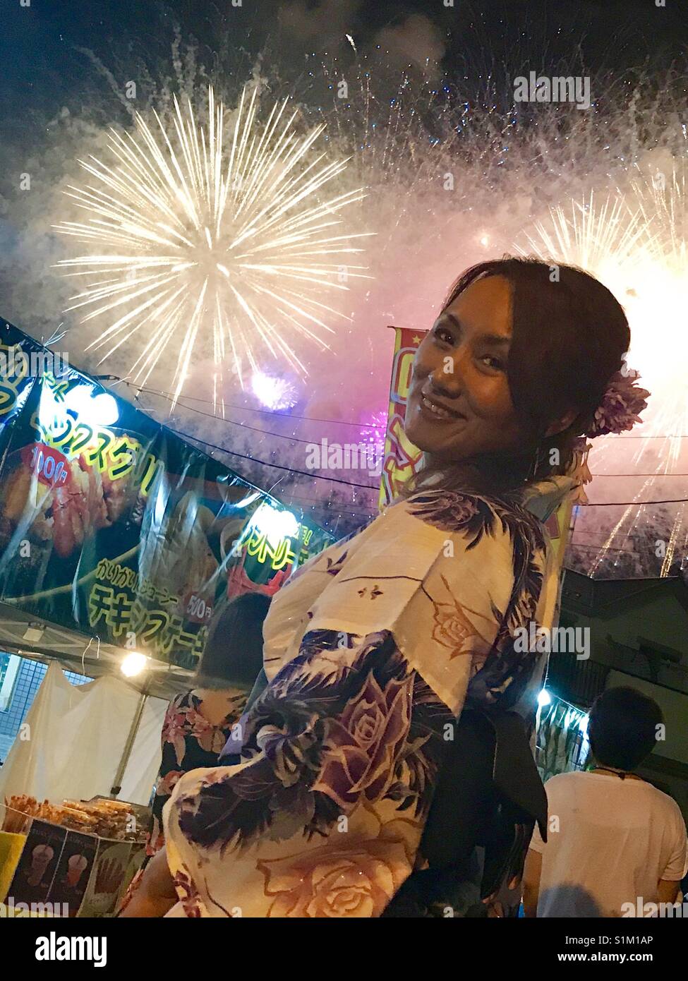 Japanese lady at firework party Stock Photo