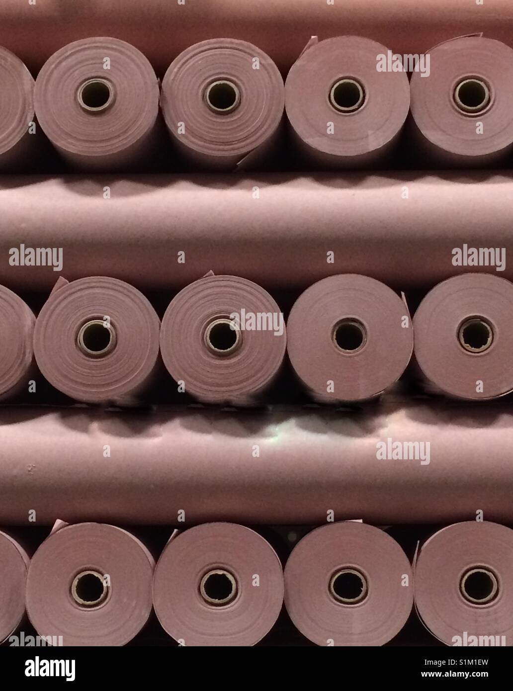Rolls of roofing paper stacked on a pallet Stock Photo Alamy