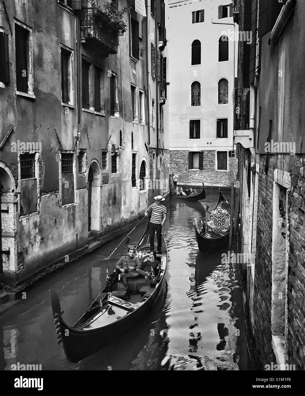 Black and white of gondola on a canal in Venice. Stock Photo
