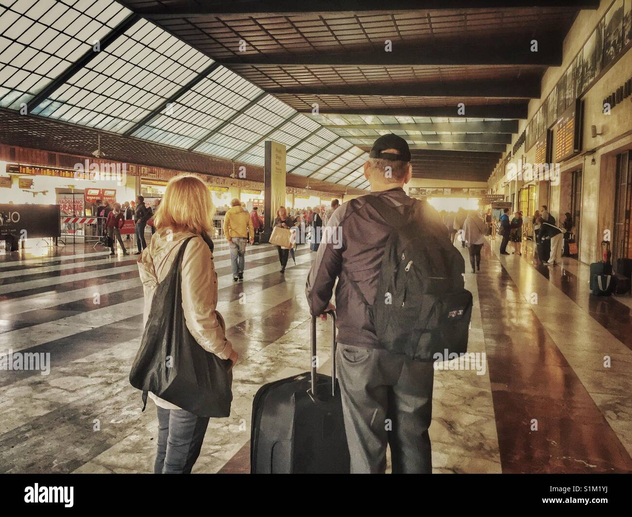 Tourists with luggage at Florence train station Stock Photo Alamy
