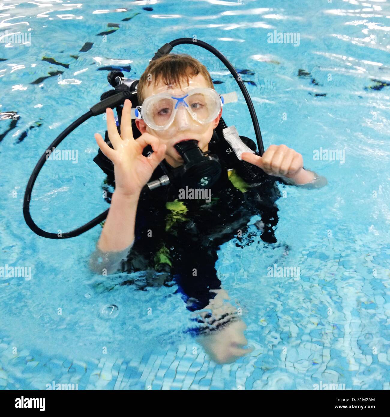 Boy diving pool wetsuit hires stock photography and images Alamy