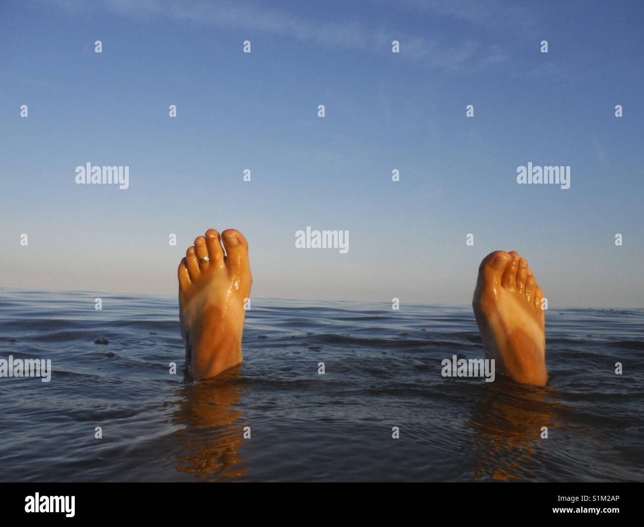 Invisible flip flops Stock Photo