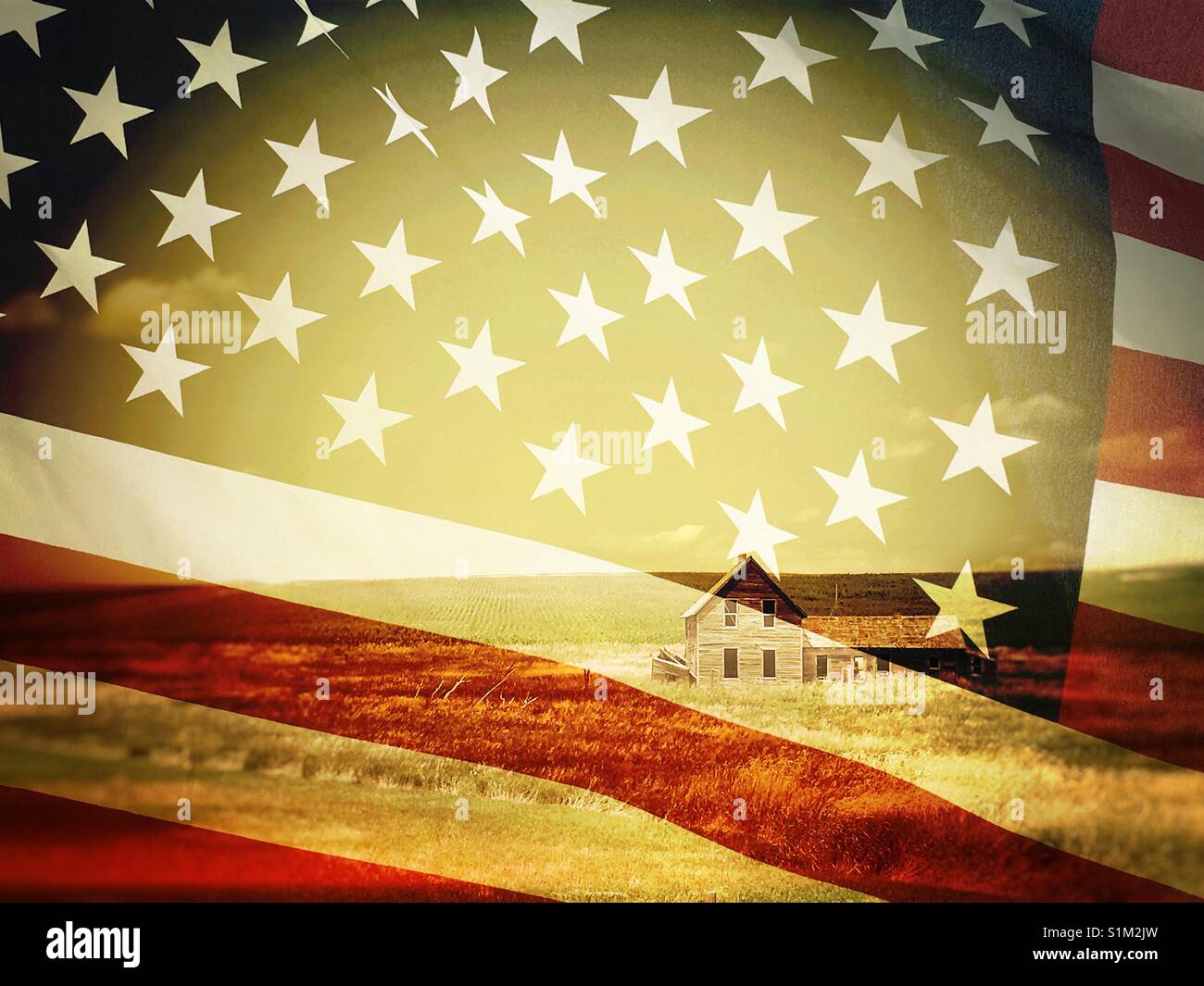 Double exposure photo of a wooden barn in a field and United States flag - Smartphone Captured Stock Image
