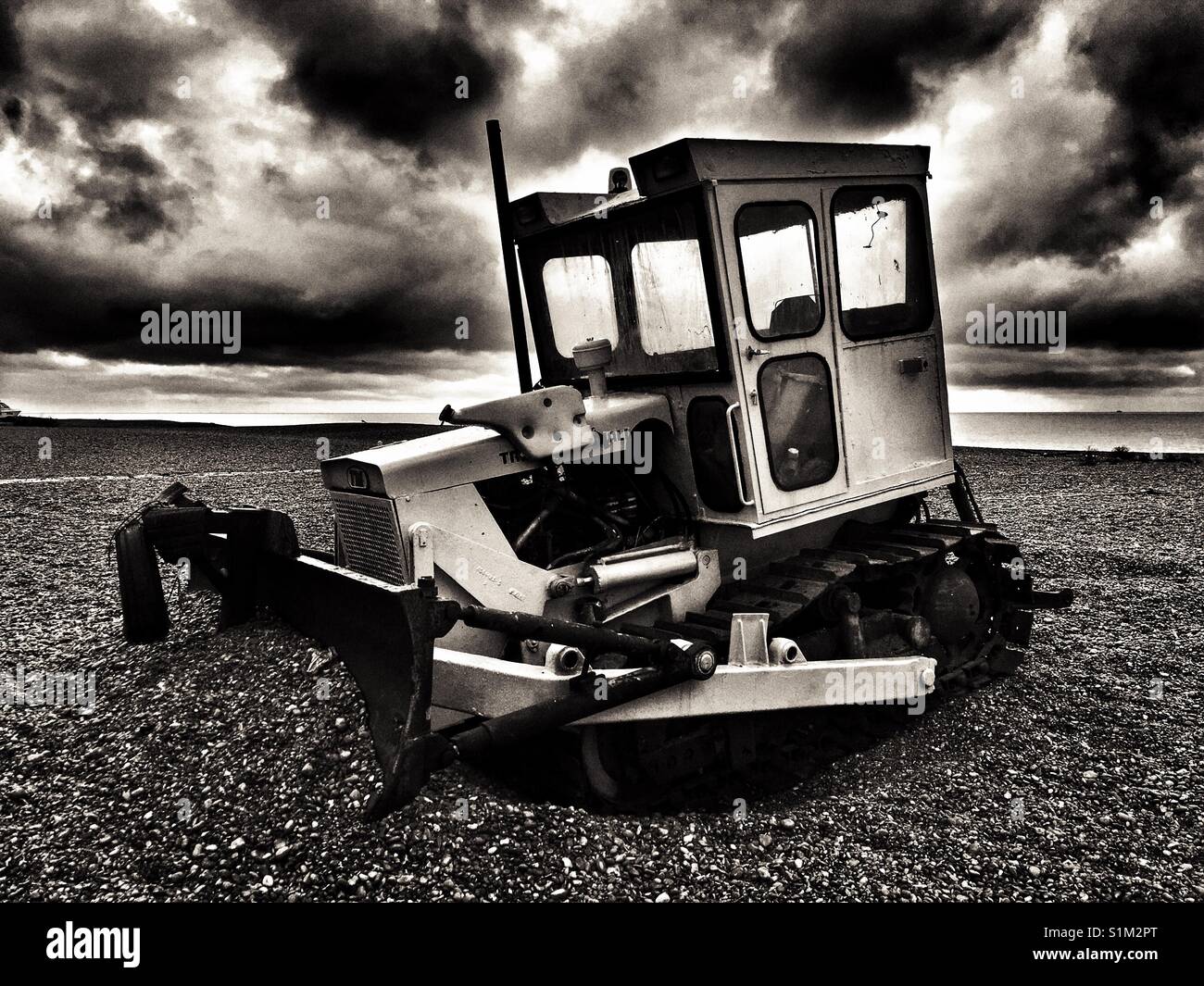 Track Marshal caterpillar bulldozer, used for pulling fishing boats out of the North Sea, Aldeburgh, Suffolk, UK. - Smartphone Captured Stock Image