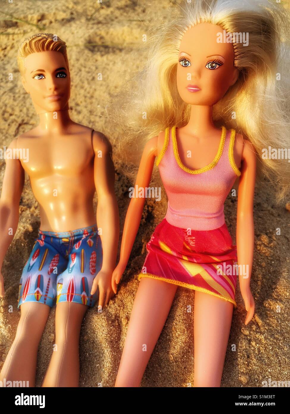 Barbie and Ken sunbathing - Smartphone Captured Stock Image