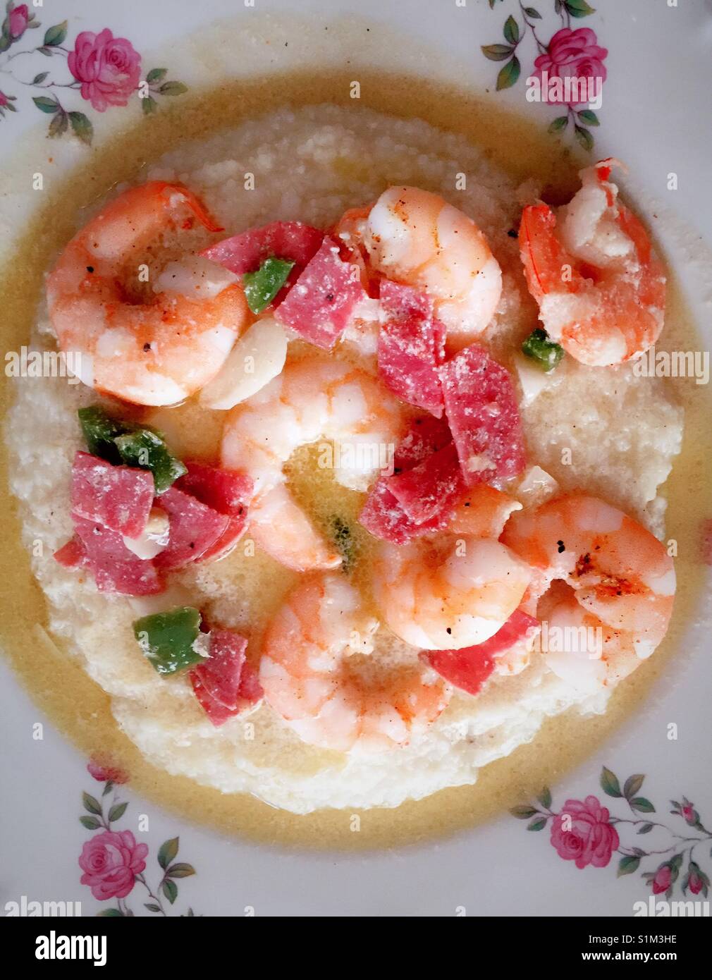 Shrimp and grits served on a China plate, USA Stock Photo