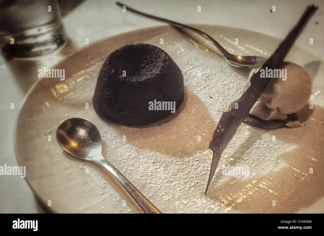 An elegant chocolate bomb dessert. Stock Photo