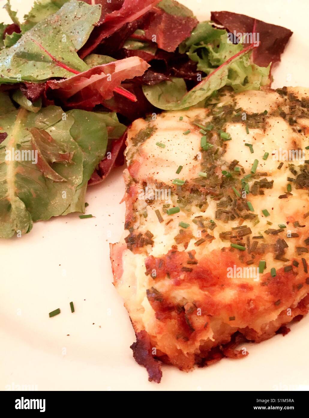 Quiche and salad meal at a bistro, NYC, USA - Smartphone Captured Stock Image