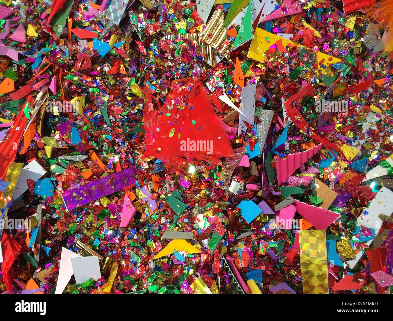 Red feather in glitter. - Smartphone Captured Stock Image