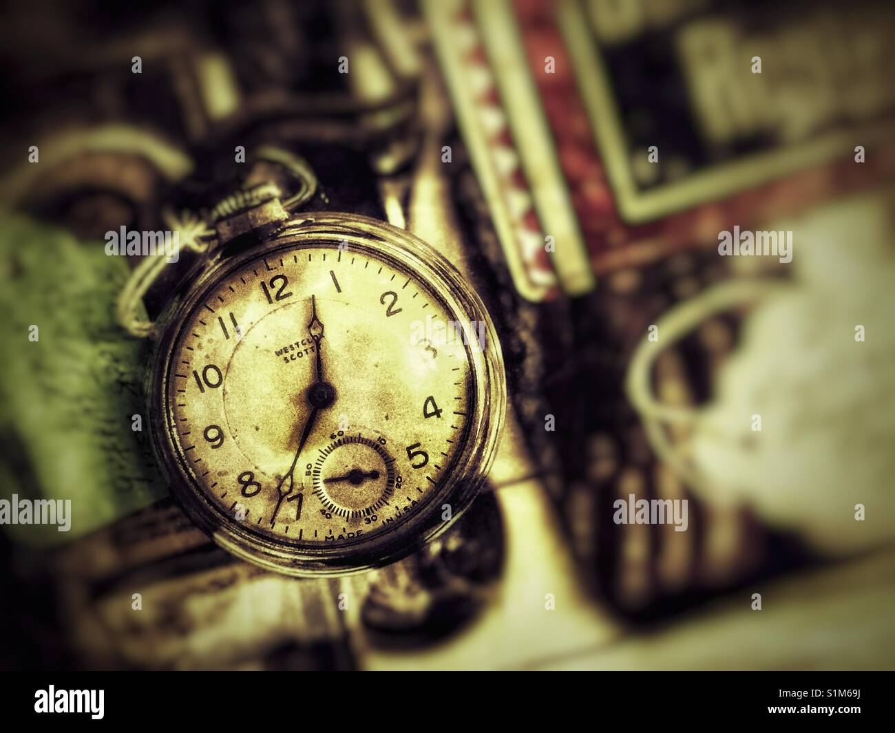Antique pocket watch in glass case at flea market - Smartphone Captured Stock Image