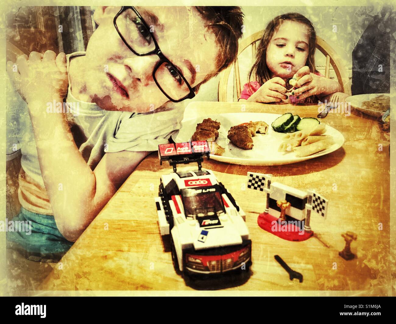 7 year old boy with the Lego Audi Racing Car set which he has just completed. Stock Photo