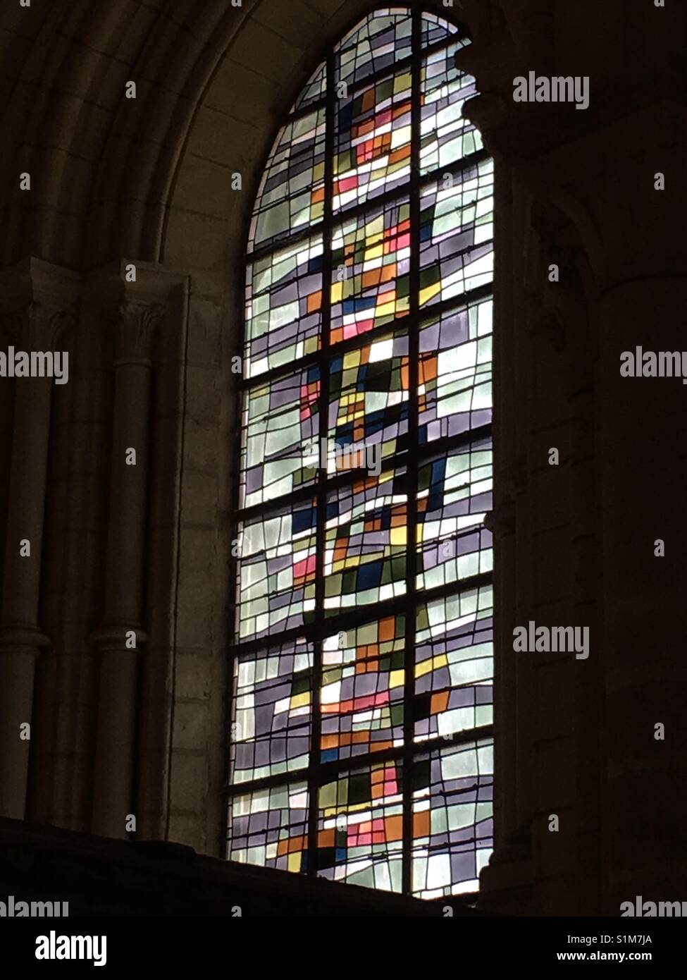 Stained glass window in Cathedral Norte-Dame de Lain in Laon in France - Smartphone Captured Stock Image
