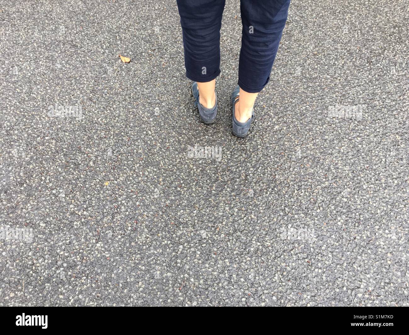 Walking on pavement Stock Photo Alamy