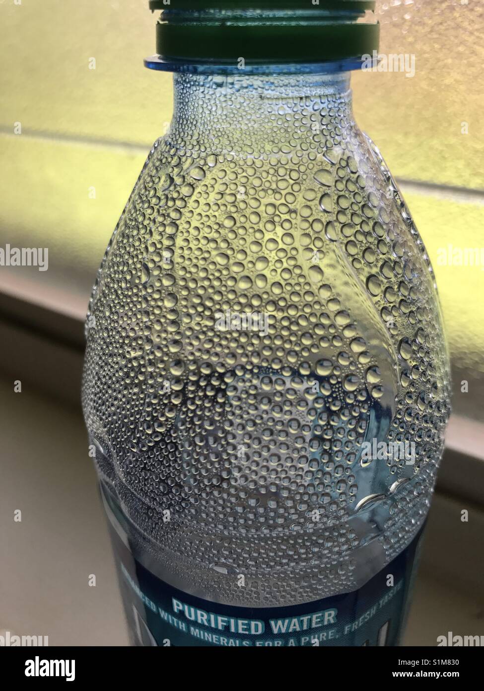Water drop in a magnifiscent bottle Stock Photo Alamy