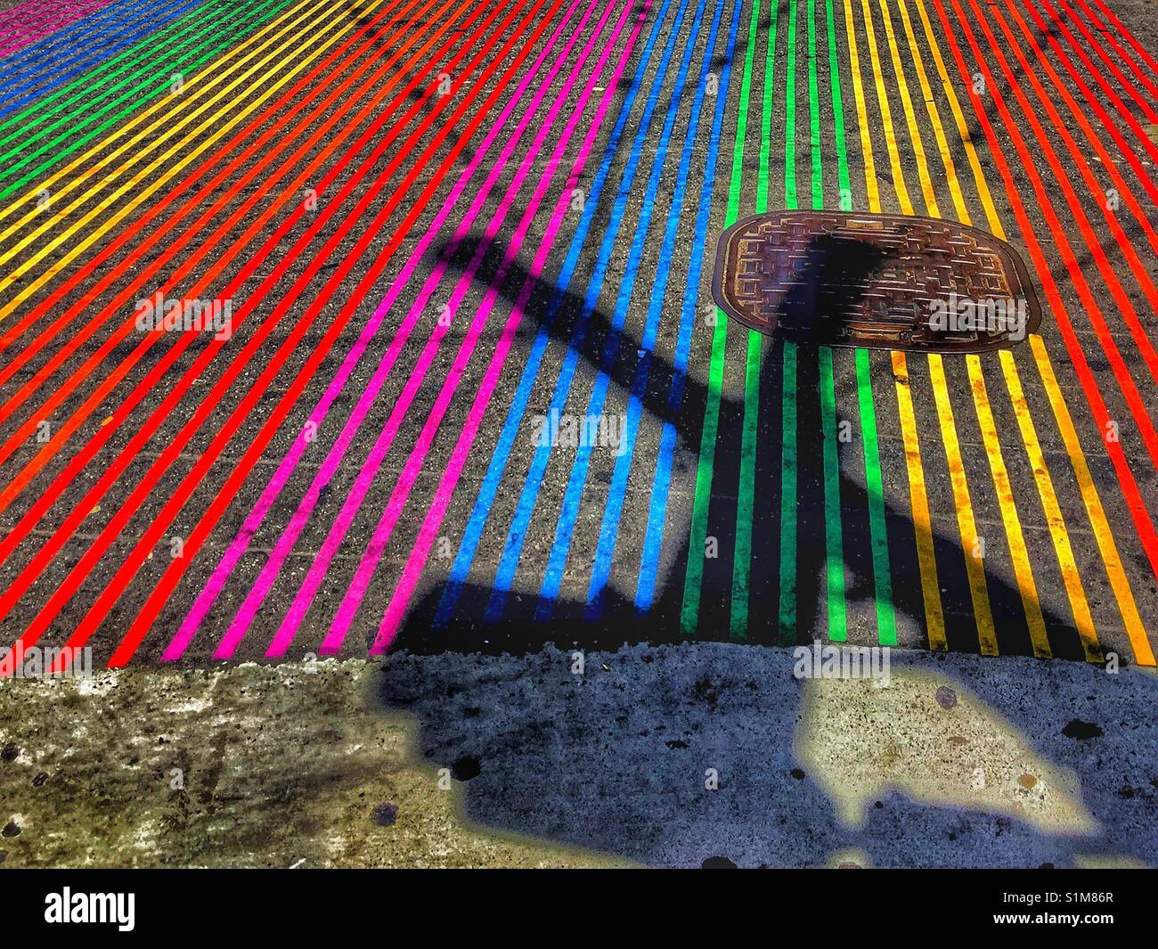 Iconic gay street crosswalk in The Castro district of San Francisco, USA. Stock Photo