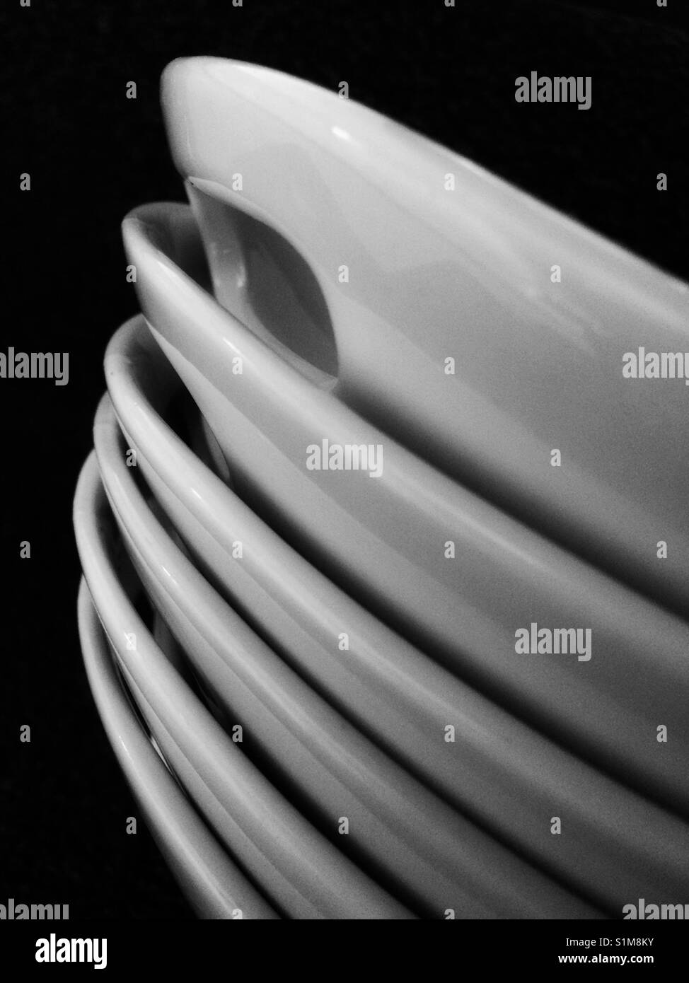 White dishes in a pile Stock Photo
