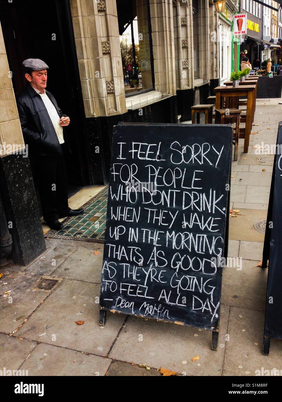 Funny notice in a pub entrance Stock Photo