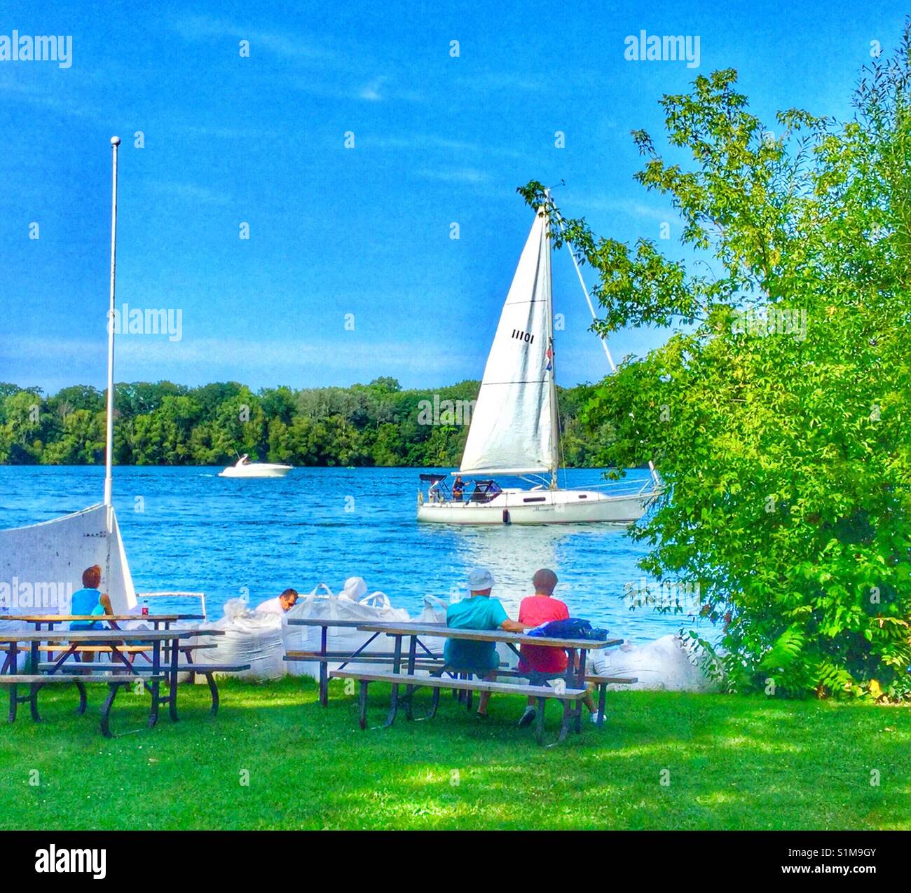 People enjoying a sunny summer day by the Niagara River. Stock Photo