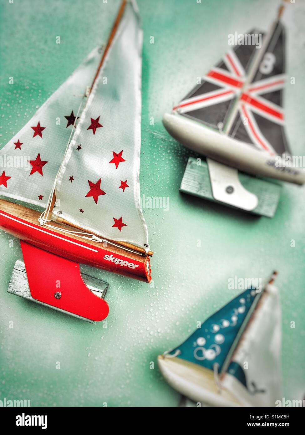 Skipper toy yachts for sale, Aldeburgh, Suffolk, England. - Smartphone Captured Stock Image