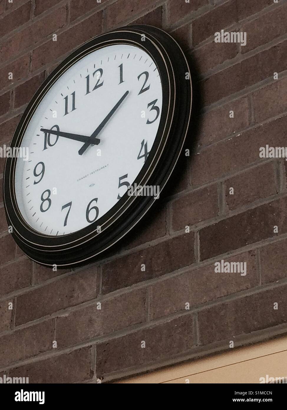 Clock on the wall Stock Photo Alamy