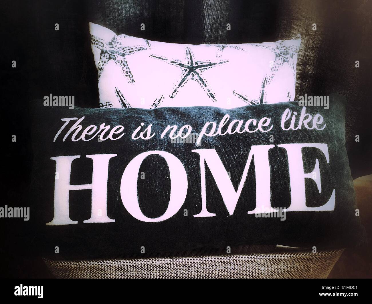 Home decor- there is no place like home pillow. Stock Photo