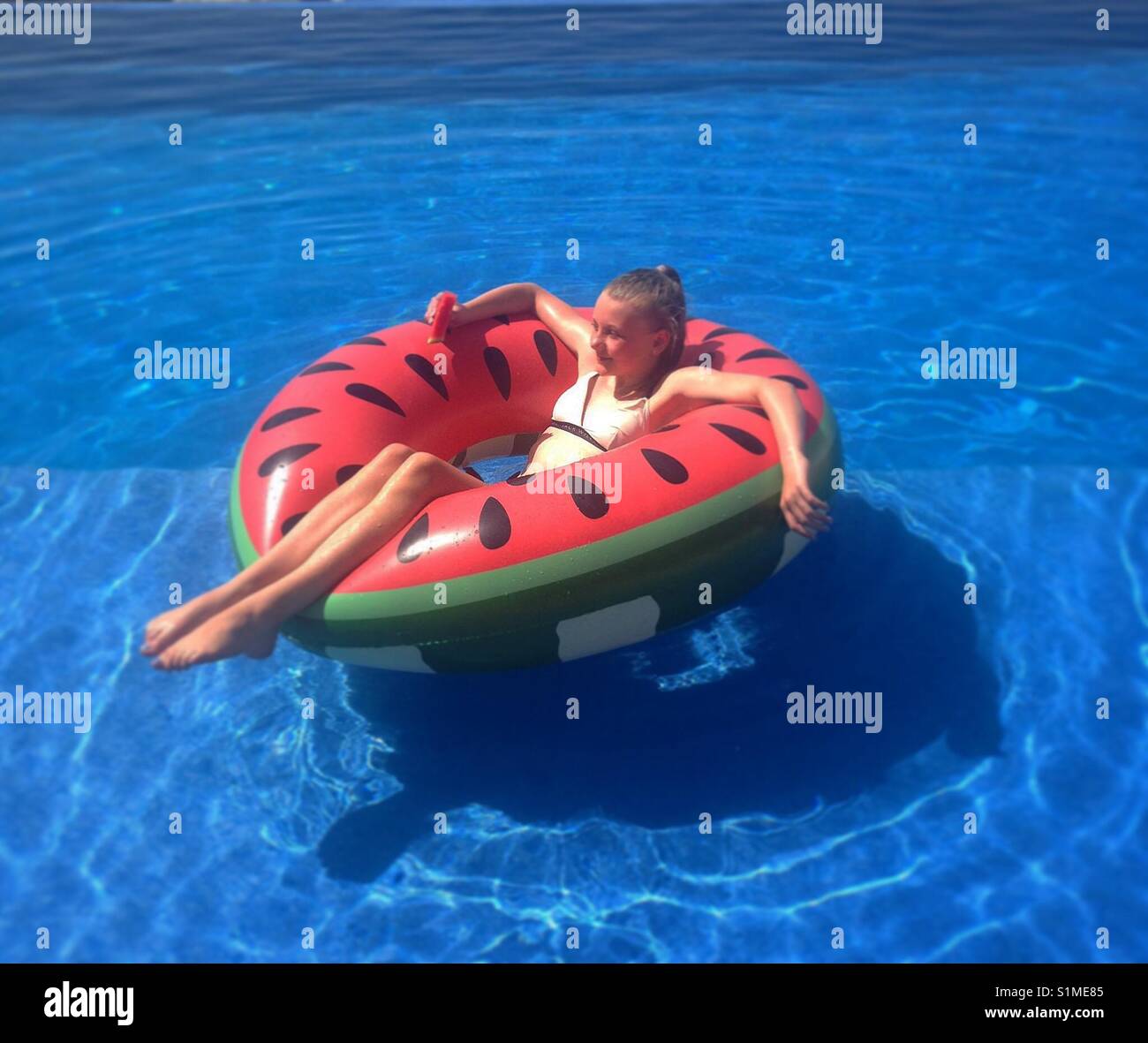 Girl in watermelon float Stock Photo
