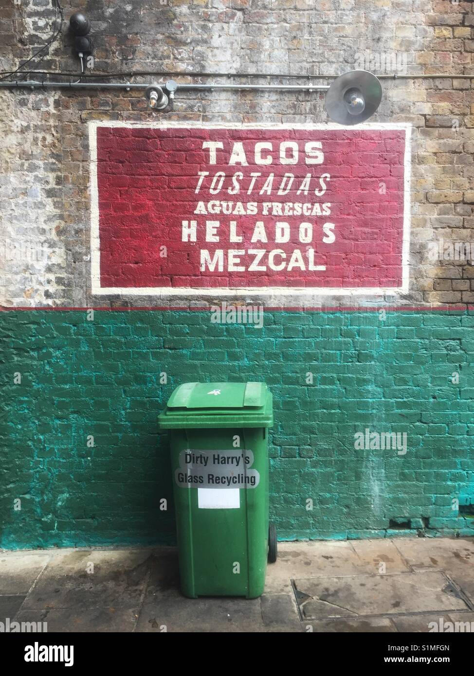Sign and recycling bin outside El Pastor restaurant in Borough Market in a London - Smartphone Captured Stock Image