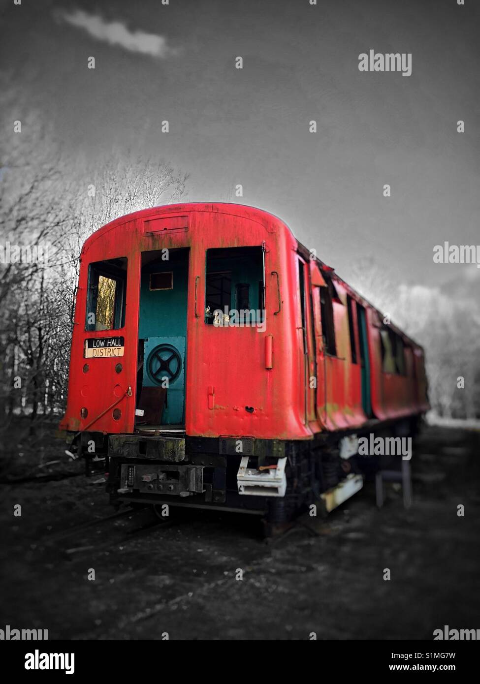 Ghost train to nowhere. Old London Underground train abandoned in the  countryside. Selective edit with mono background Stock Photo - Alamy