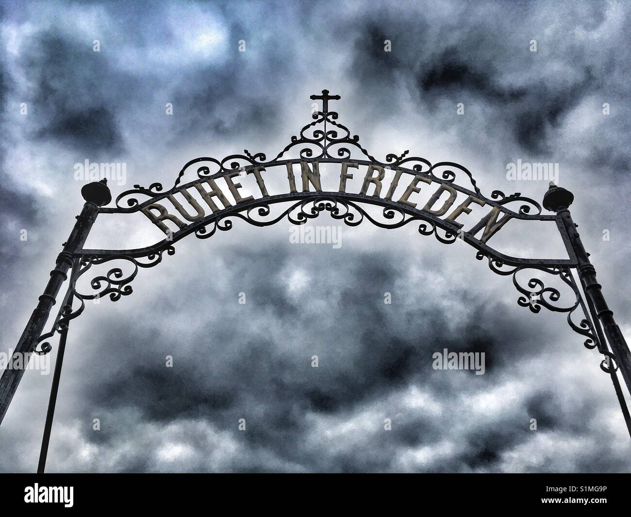 Cemetery gate against dramatic sky - Smartphone Captured Stock Image