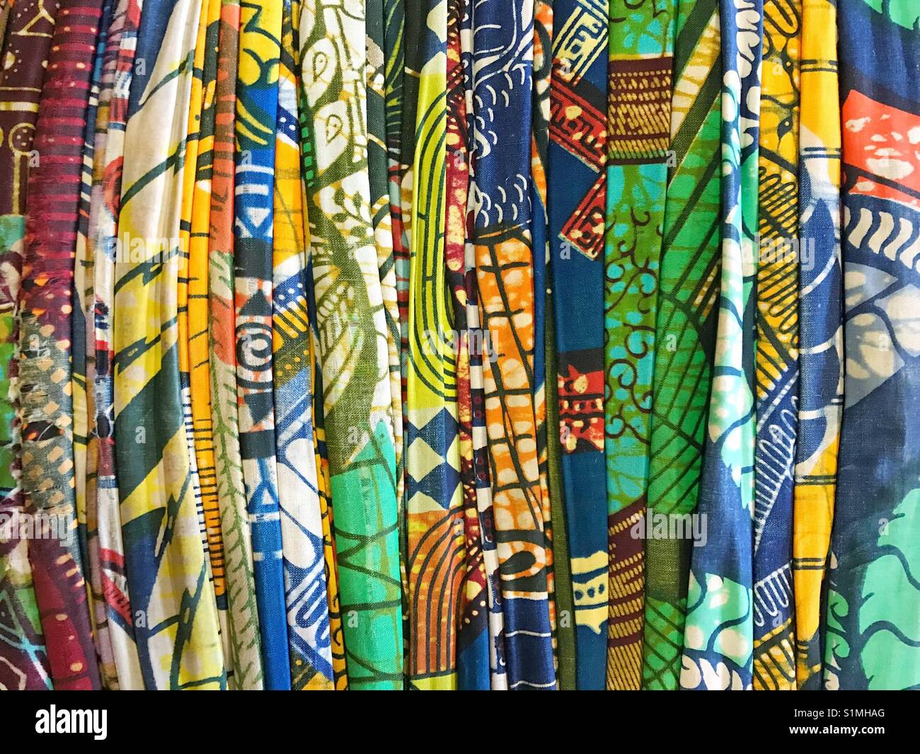 Bale of brightly coloured cotton fabric - Smartphone Captured Stock Image