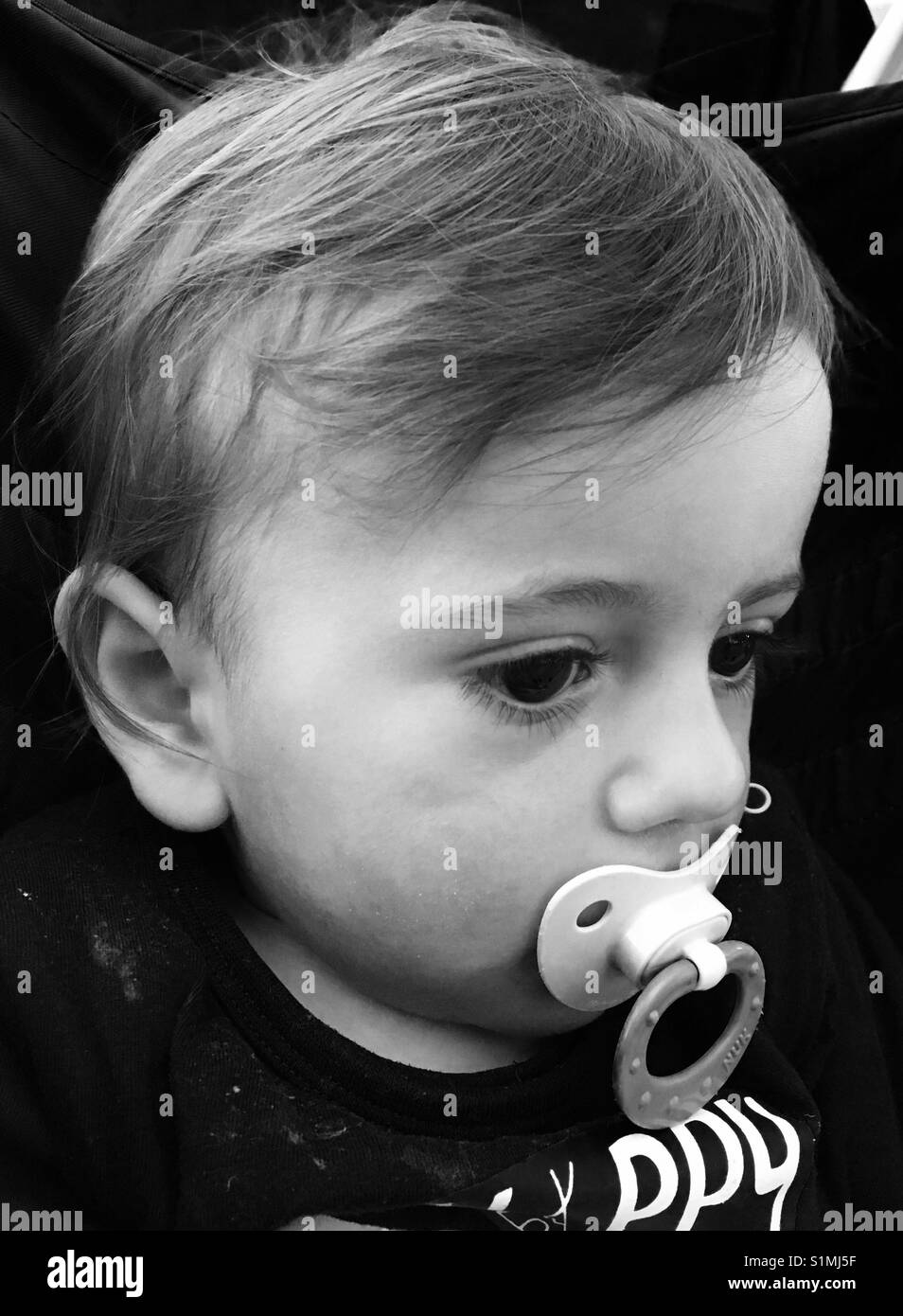Little boy with pacifier Stock Photo Alamy