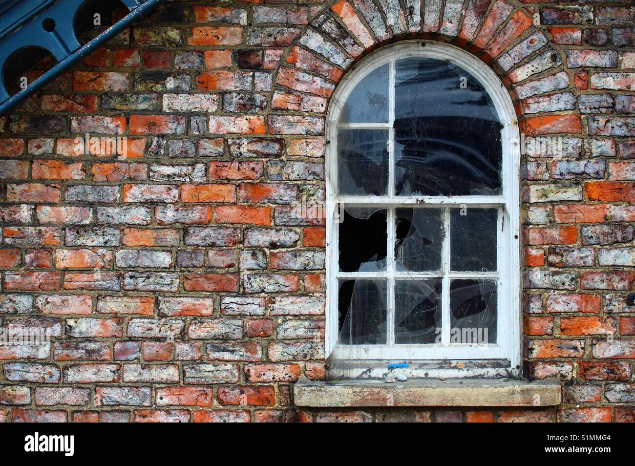 Derelict window/red brick wall Stock Photo