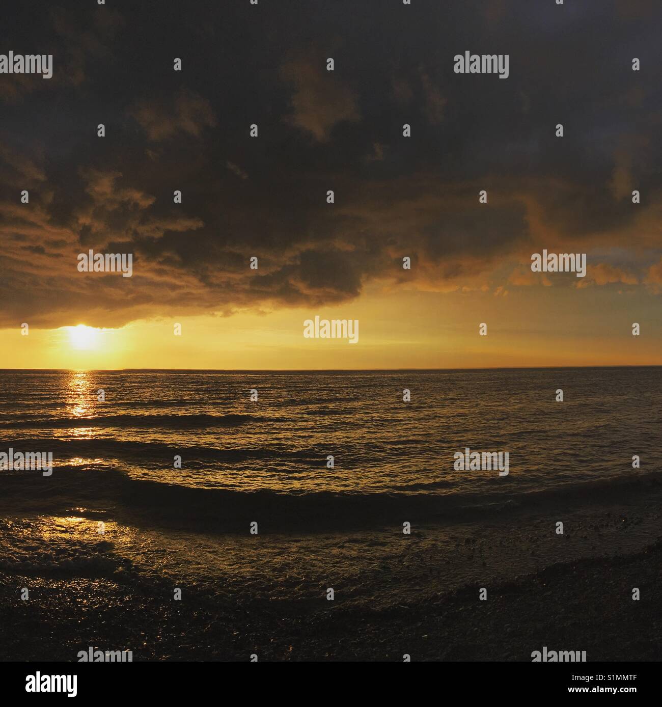 Stormy sky beach hi-res stock photography and images - Alamy