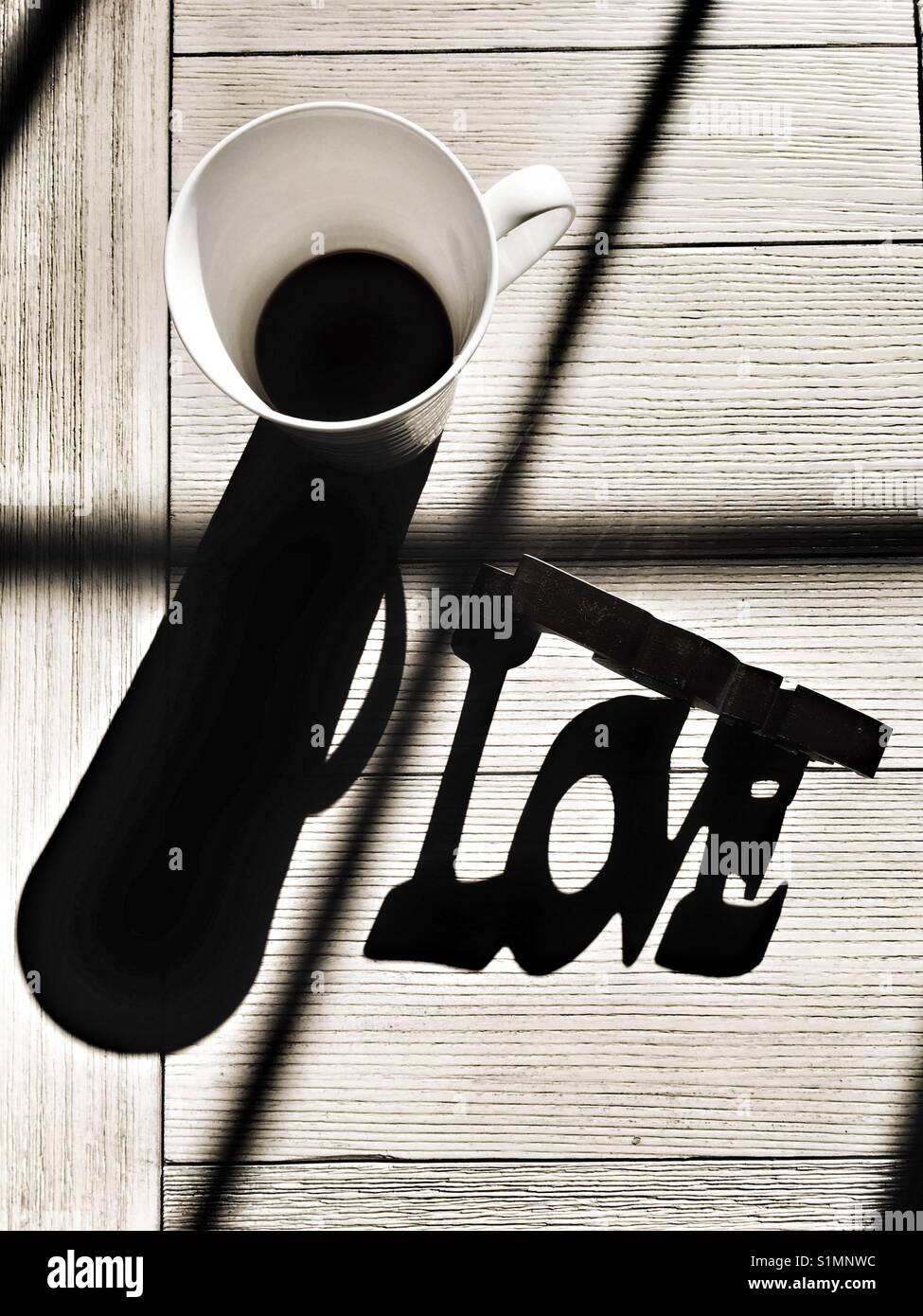 Sun light and shadows. Coffee cup and Love sign. - Smartphone Captured Stock Image